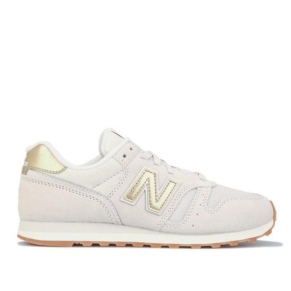 New Balance Women's Sneakers in Light Pink with Gold Accents